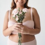 Women with polycystic ovary syndrome exhibit impaired endometrial receptivity with excessive ER and histone lactylation