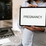 Women with polycystic ovary syndrome exhibit impaired endometrial receptivity with excessive ER and histone lactylation