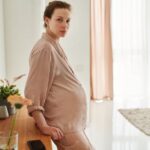 Women with polycystic ovary syndrome exhibit impaired endometrial receptivity with excessive ER and histone lactylation