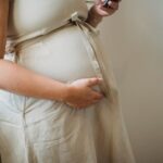 Women with polycystic ovary syndrome exhibit impaired endometrial receptivity with excessive ER and histone lactylation