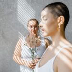 Women with polycystic ovary syndrome exhibit impaired endometrial receptivity with excessive ER and histone lactylation