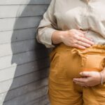 Women with polycystic ovary syndrome exhibit impaired endometrial receptivity with excessive ER and histone lactylation