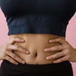 Women with polycystic ovary syndrome exhibit impaired endometrial receptivity with excessive ER and histone lactylation