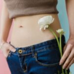 Women with polycystic ovary syndrome exhibit impaired endometrial receptivity with excessive ER and histone lactylation